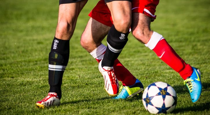 Two players playing football